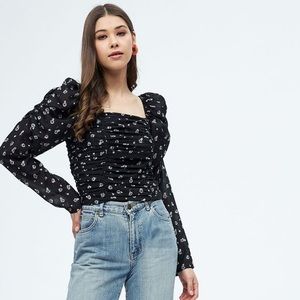 Black ruffled TOP WITH FLORAL DETAILS SIZE MEDIUM